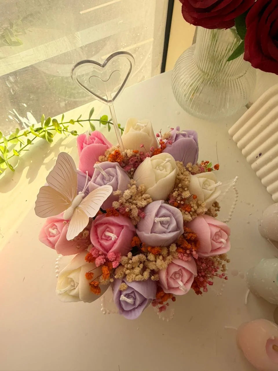 Pastel rose candle bouquet with butterfly detail