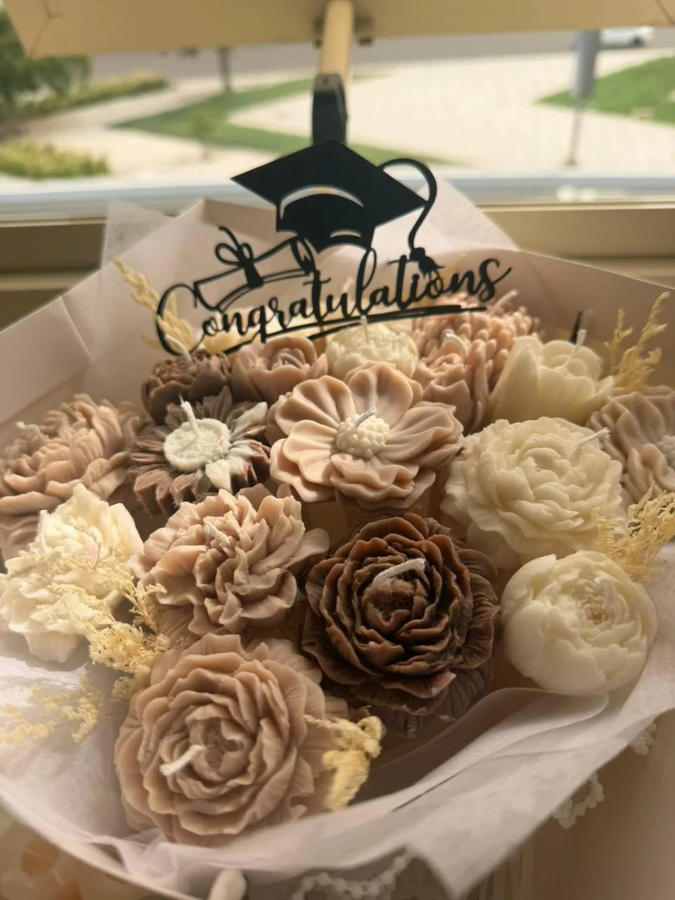 Neutral graduation candle bouquet