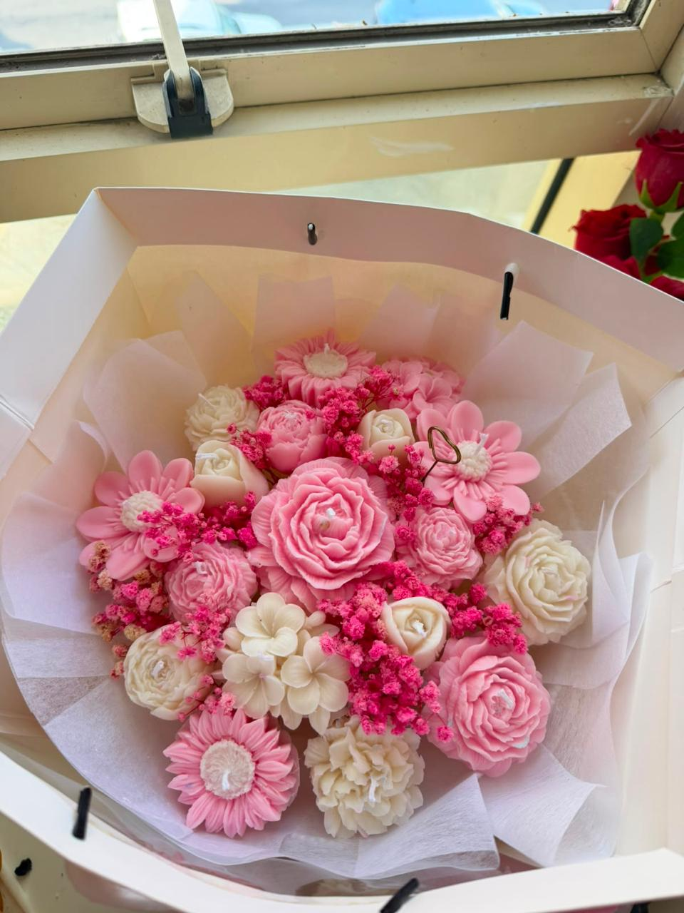 Pink and ivory candle bouquet with daisy flowers