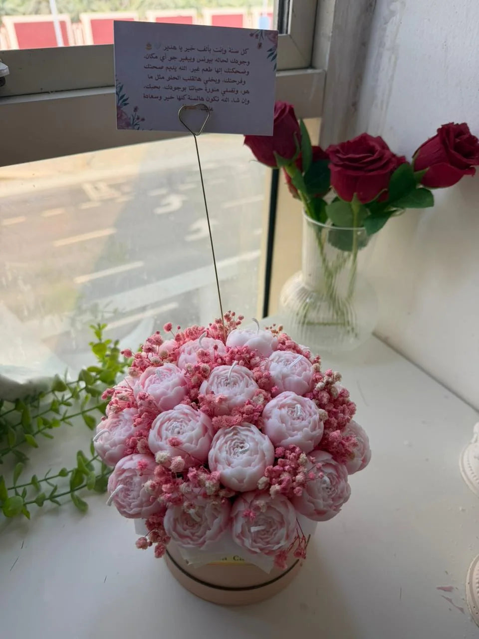 Pink peony shaped candles arranged as a bouquet
