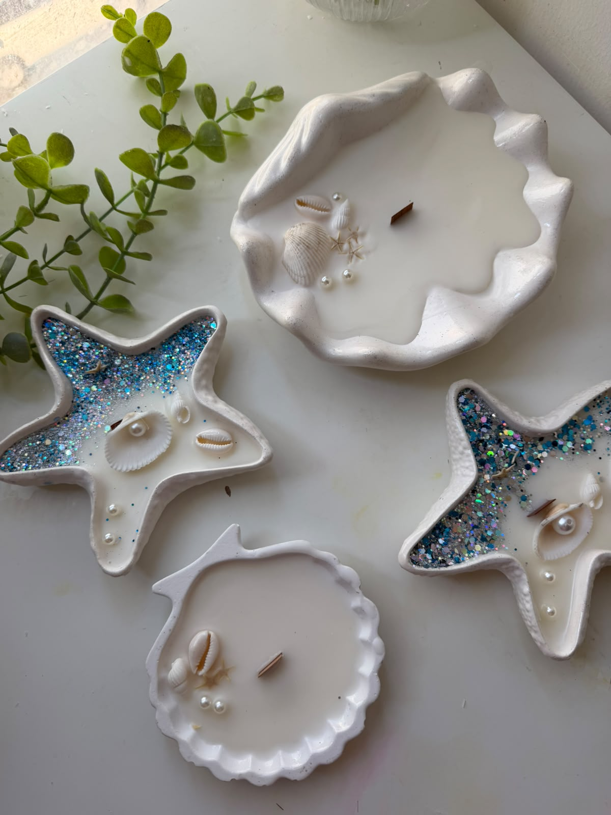 Owner's original photo: round scalloped shell candle with the other coastal candles