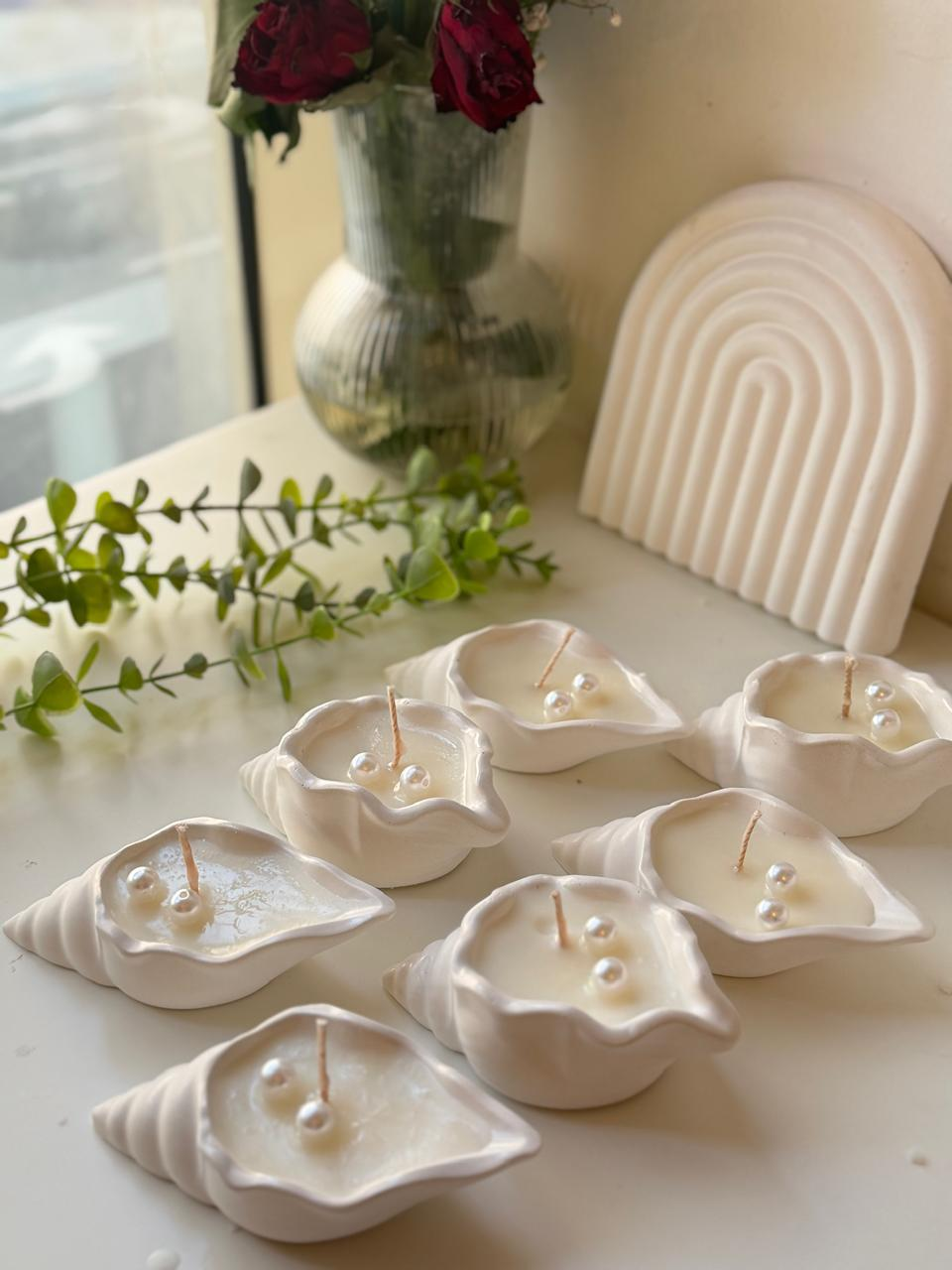 Ivory shell shaped candle with pearl details