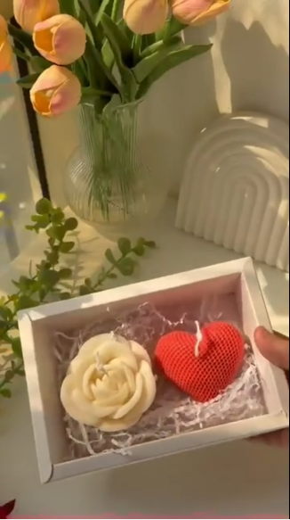 White Valentine gift box with an ivory rose candle and a red textured heart candle