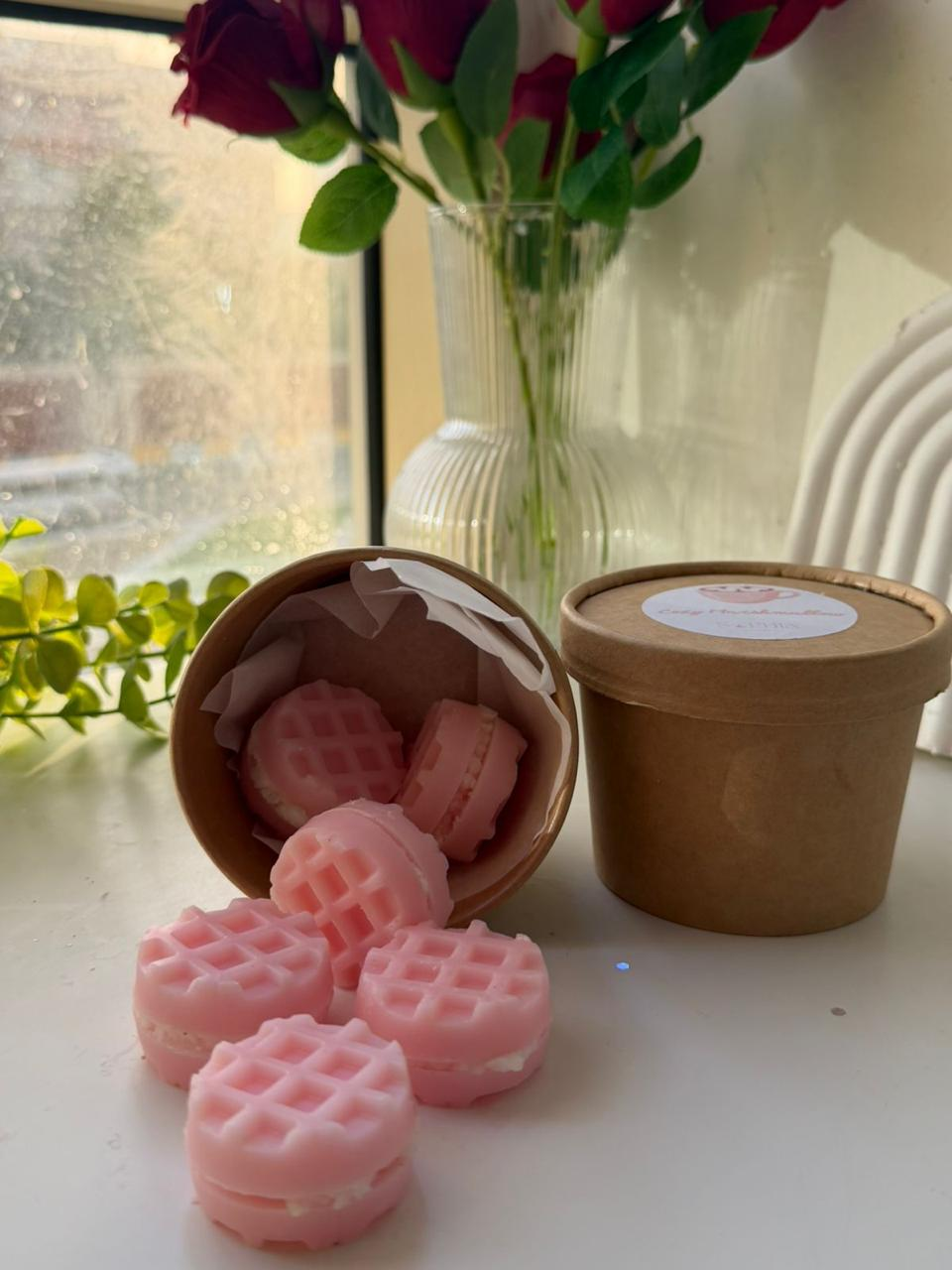 Pink waffle shaped scented wax melts in a kraft tub