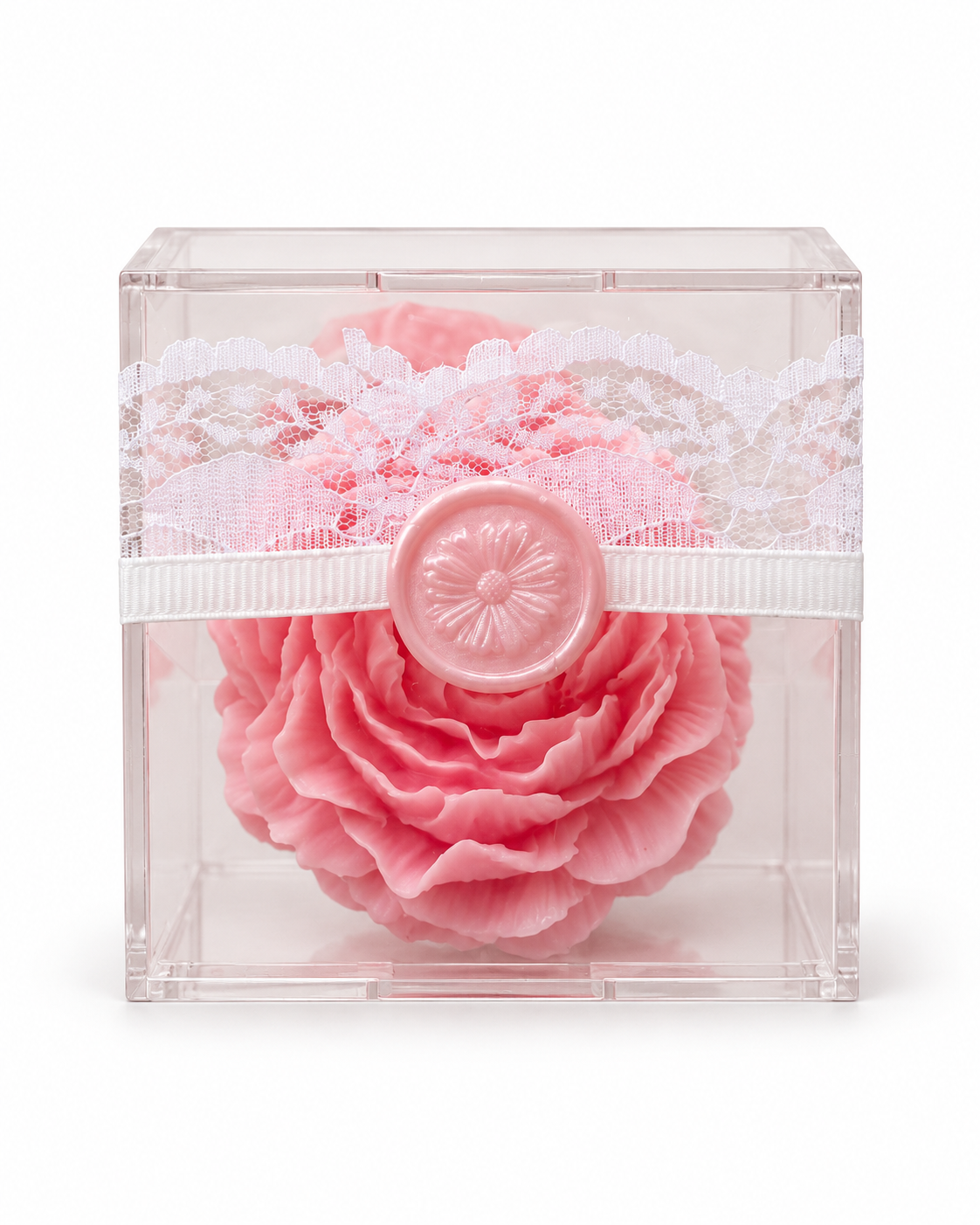 Pink rose candle in a clear acrylic gift box with white lace and pink floral seal on a white background